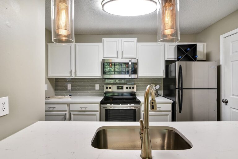 Kitchen with white cabinets and stainless steel appliances