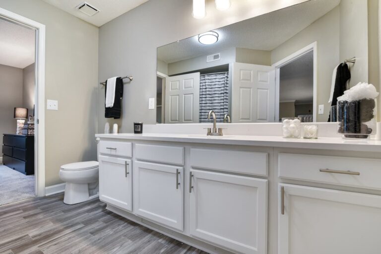 Full bathroom with white under cabinets